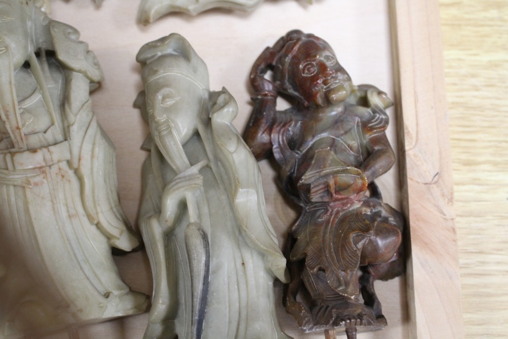 A Chinese soapstone group of eight immortals, late 19th / early 20th century, total H.43.5cm